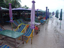 the beach, plastered with sunshades