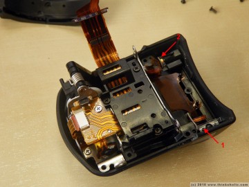 step 9: when the front part is removed, you can see the brightness sensor (to set the flash intensity?) and focus laser. if you constantly experience overexposed photos when using the flash, the problem might be a misaligned brightness sensor in relation to the little transparent plastic tube.