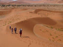 walking through the dunes of sossusvlei, at noon