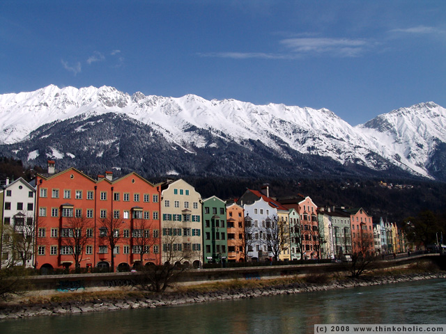 row of houses in mariahilf with snowy mountain background