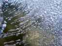 air bubbles, frozen into a layer of ice
