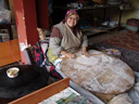 a turkish woman preparing flatbread