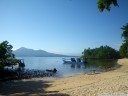 the beach just off bunaken kuskus. the reef starts about 30 meters in.. 2011-08-23 09:53:20, PENTAX Optio W60.