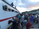 arrival of the public boat at pulau malenge, togean islands.