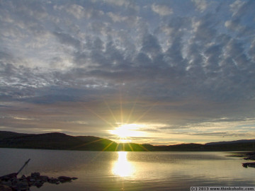 watching the midnight sun in eidvageid, seiland. at 02:16 am, after a close encounter with the horizon, the sun crawls back up towards another day.