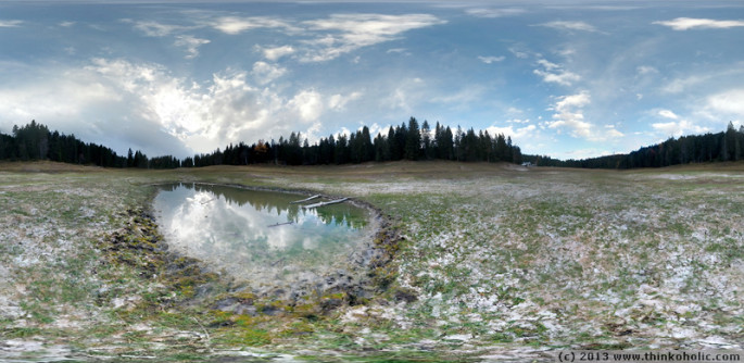 panorama: wildmoossee near seefeld, austria, is a periodic lake that only fills up every 3-4 years. here's the season's last remaining water at the very base of the basin.