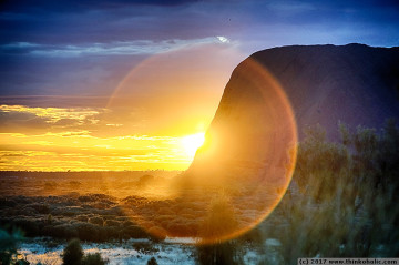 sunset behind uluru, seen from the uluru sunrise viewing platform