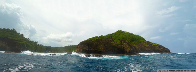 panorama: the boat entrance (left third) to apolima island, samoa